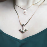 Core Anchor Pendant Solid 18K Yellow Gold rounded and Root Anchor Charm on model with emerald green silk shirt