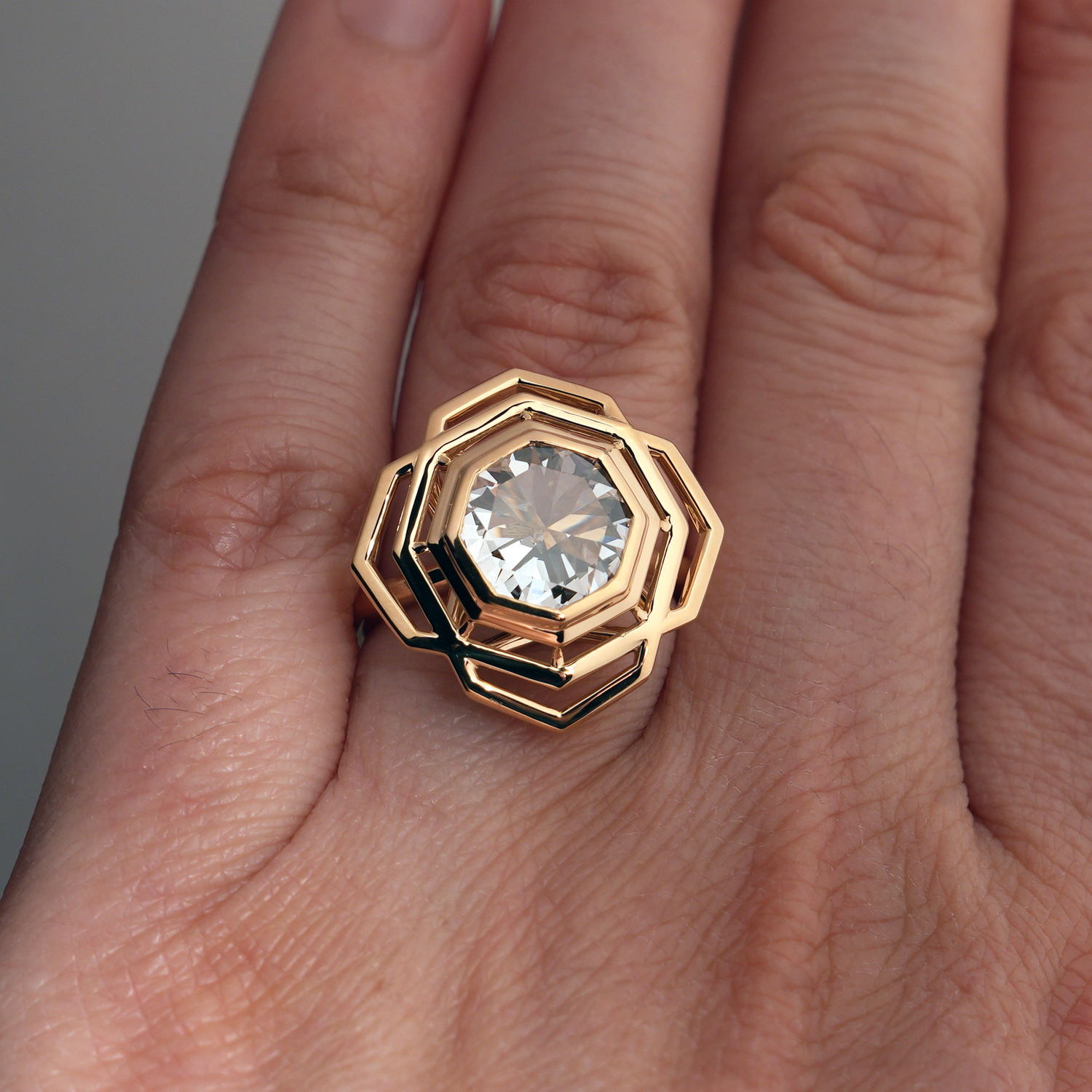 Octagonal Rose Engagement Ring on left hand